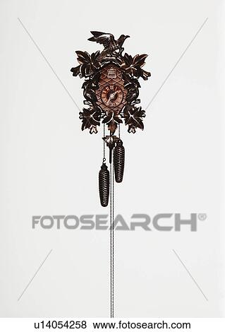 Traditional Cuckoo Clock on white wall View Large Photo Image Stock Photo - Traditional Cuckoo Clock on white wall. Fotosearch