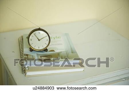 Antique clock and notebook on cabinet View Large Photo Image Stock Image - Antique clock and notebook on cabinet. Fotosearch