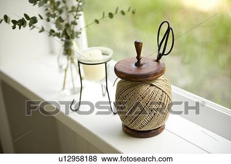 Stock Photo - Hemp string by window. Fotosearch