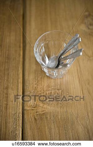 Spoons in glass View Large Photo Image Picture - Spoons in glass. Fotosearch
