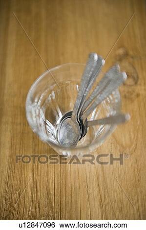 Spoons in glass View Large Photo Image Stock Photograph - Spoons in glass. Fotosearch