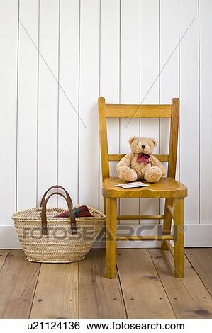 Stock Photograph - Stuffed animal on chair. Fotosearch