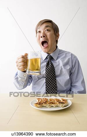 Businessman drinking beer View Large Photo Image Stock Image - Businessman drinking beer. Fotosearch