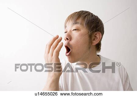 Mid adult man checking his breath View Large Photo Image Stock Photograph - Mid adult man checking his breath. Fotosearch