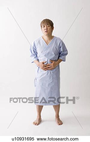 Mid adult man suffering from abdominal pain View Large Photo Image Stock Photography - Mid adult man suffering from abdominal pain. Fotosearch