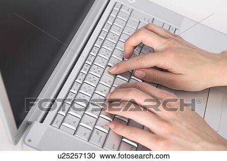 Hand of a woman hitting the keyboard of the PC View Large Photo Image Stock Image - Hand of a woman hitting the keyboard of the PC. Fotosearch