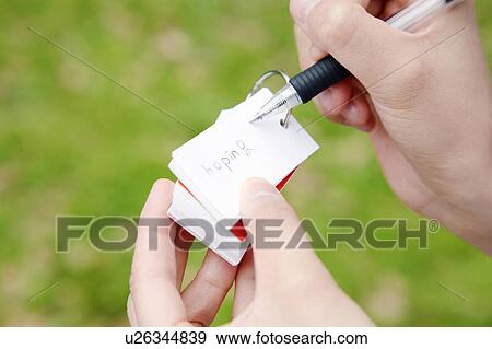 Stock Photo - Hand of a woman taking the memo. Fotosearch