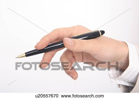 Stock Image - Hand of woman having a pen. Fotosearch