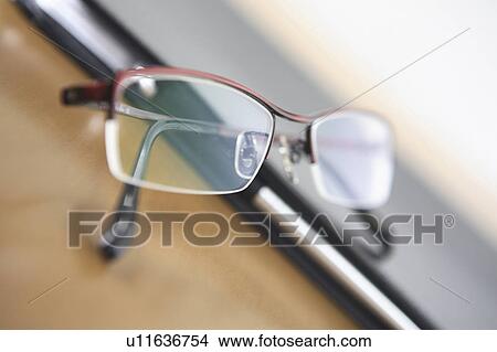 Notebook and glasses View Large Photo Image Picture - Notebook and glasses. Fotosearch