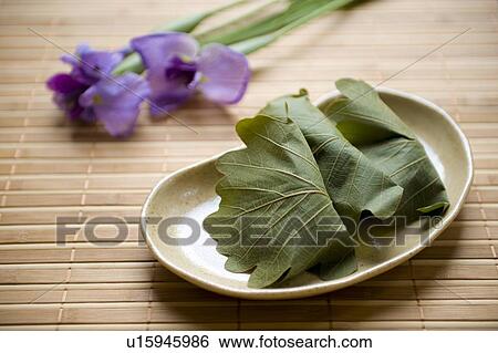 Stock Photograph - Kashiwamochi and iris. Fotosearch
