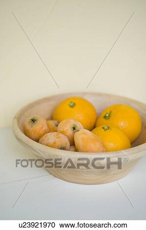 Stock Image - Loquat and orange. Fotosearch