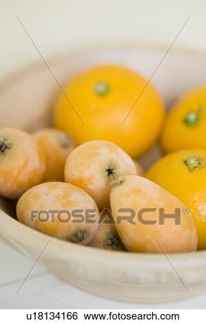 Loquat and orange View Large Photo Image Stock Photograph - Loquat and orange. Fotosearch