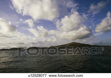 Stock Photo - Clouds over the sea. Fotosearch