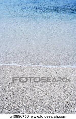 High angle view of a wave breaking on the beach View Large Photo Image Stock Image - High angle view of a wave breaking on the beach. Fotosearch