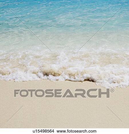 High angle view of waves breaking on the beach View Large Photo Image Picture - High angle view of waves breaking on the beach. Fotosearch