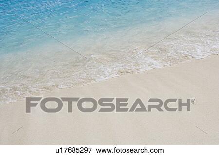 High angle view of waves breaking on the beach View Large Photo Image Stock Photo - High angle view of waves breaking on the beach. Fotosearch