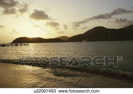 Stock Image - Silhouette of mountains at dusk. Fotosearch