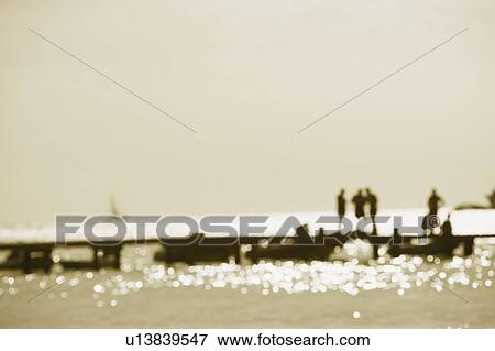 Tourists on a jetty in the sea (Blur) View Large Photo Image Stock Photo - Tourists on a jetty in the sea (Blur). Fotosearch