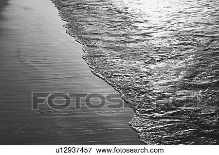 Stock Photo - Waves on the beach. Fotosearch