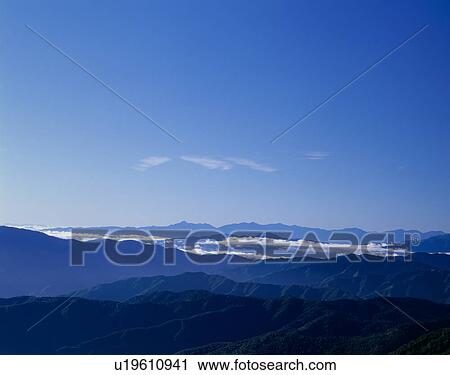 Stock Image - "Sky And Mountains, Nagano, Japan". Fotosearch