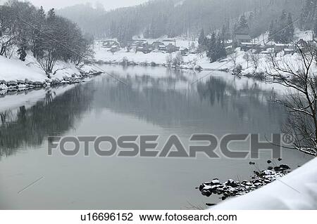 Stock Image - "Snowscape Of River, Nagano, Japan". Fotosearch