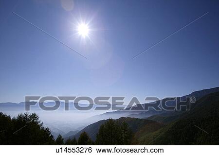 Stock Photograph - "Sun Light And Mountains, Nagano, Japan". Fotosearch