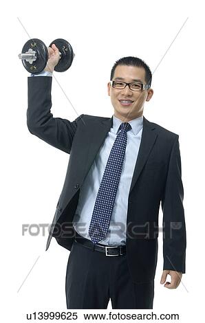 Stock Photography - Businessman holding a dumbbell. Fotosearch