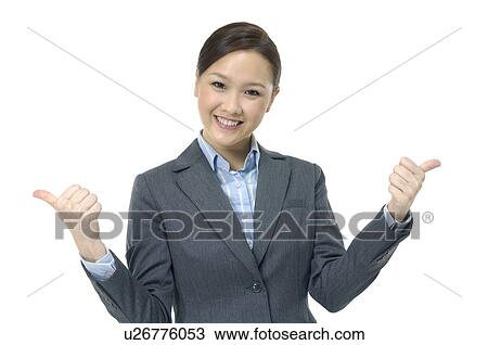Businesswoman showing thumbs up and smiling View Large Photo Image Stock Image - Businesswoman showing thumbs up and smiling. Fotosearch