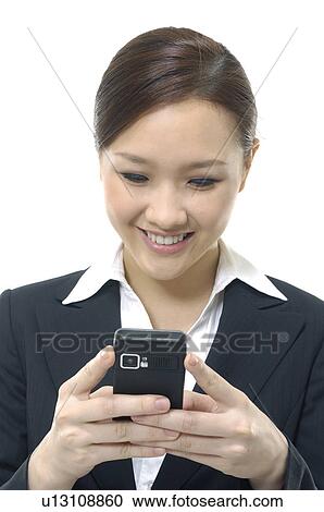 Close-up of a businesswoman text messaging View Large Photo Image Stock Image - Close-up of a businesswoman text messaging. Fotosearch
