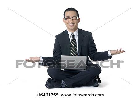 Portrait of a businessman working on a laptop View Large Photo Image Stock Photography - Portrait of a businessman working on a laptop. Fotosearch