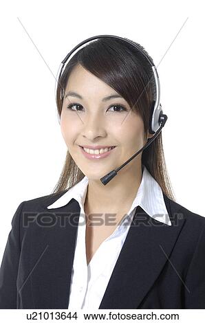 Portrait of a female customer care executive smiling View Large Photo Image Picture - Portrait of a female customer care executive smiling. Fotosearch