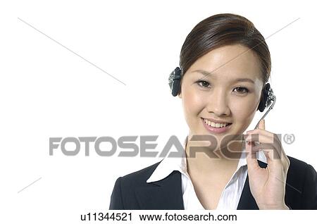 Portrait of a female customer care executive smiling View Large Photo Image Stock Image - Portrait of a female customer care executive smiling. Fotosearch