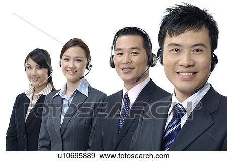 Portrait of four customer care executives smiling View Large Photo Image Stock Photo - Portrait of four customer care executives smiling. Fotosearch