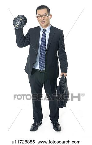 Stock Photography - Businessman holding a dumbbell and a bag. Fotosearch