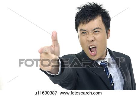 Stock Photo - Businessman shouting and pointing forward. Fotosearch