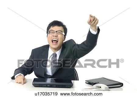 Stock Photo - Businessman shouting and pointing forward. Fotosearch
