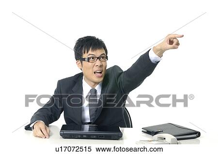 Stock Photography - Businessman shouting and pointing forward. Fotosearch