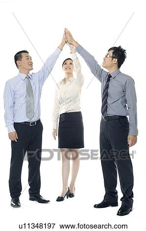 Stock Photo - Businesspeople joining their hands. Fotosearch