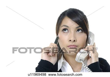 Businesswoman talking on a mobile phone View Large Photo Image Stock Photo - Businesswoman talking on a mobile phone. Fotosearch