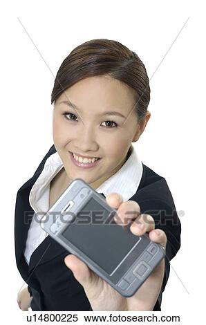 Portrait of a businesswoman showing a mobile phone View Large Photo Image Stock Photography - Portrait of a businesswoman showing a mobile phone. Fotosearch