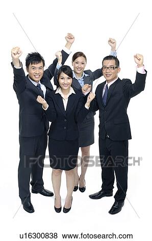 Stock Photo - Business team celebrating their success. Fotosearch