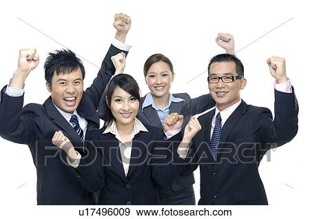 Stock Photo - Business team celebrating their success. Fotosearch