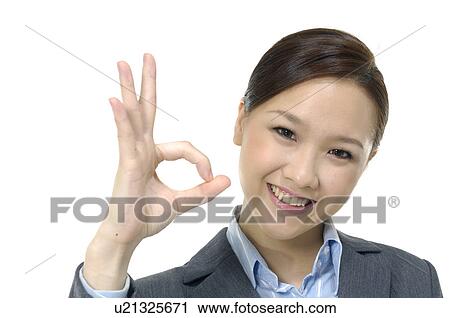 Stock Image - Business team showing OK sign. Fotosearch