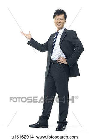Picture - Businessman giving presentation against a white background. Fotosearch