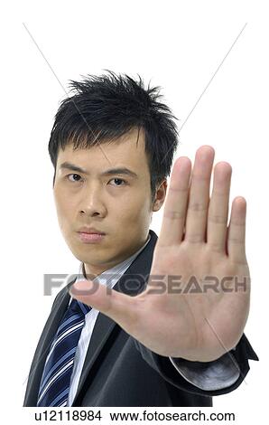 Businessman showing stop sign View Large Photo Image Picture - Businessman showing stop sign. Fotosearch
