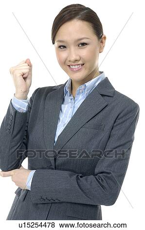 Stock Photo - Businesswoman clenching her fist. Fotosearch