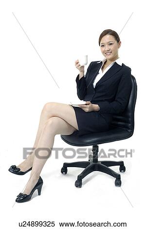 Stock Photography - Businesswoman holding a tea cup. Fotosearch