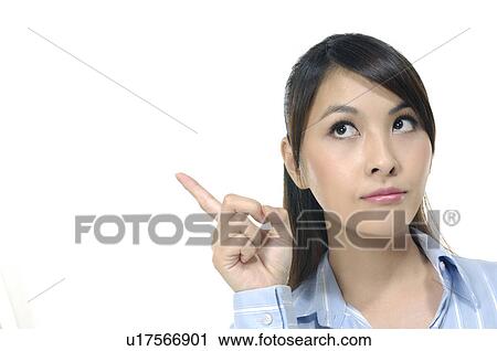 Businesswoman pointing upwards View Large Photo Image Stock Image - Businesswoman pointing upwards. Fotosearch