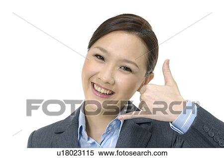 Stock Photography - Businesswoman pretending to talk on a phone. Fotosearch