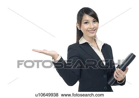 Stock Photo - Businesswoman showing her palm and holding a file. Fotosearch